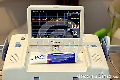 Cardiotocography device placed on mother's abdomen recording the fetal heart rate obtained via ultrasound transducer Editorial Stock Photo