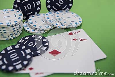 Cards and chips on green and yellow casino table. Abstract casino gambling photo Stock Photo