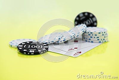 Cards and chips on green and yellow casino table. Abstract casino gambling photo Stock Photo