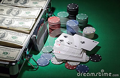 Cards, chips and suitcase of money on the green Stock Photo