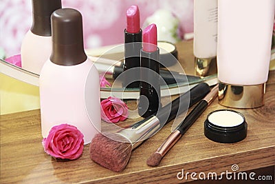 Care and decorative cosmetics, face lotion, body cream, lip gloss, lipstick, makeup a brushes Stock Photo