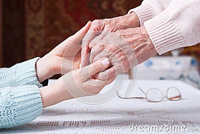 Care is at home of elderly. Senior woman with their caregiver at home. Concept of health care for elderly old people Stock Photo