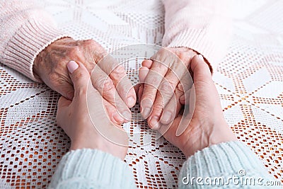 Care is at home of elderly. Senior woman with their caregiver at home. Concept of health care for elderly old people Stock Photo