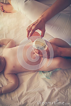 Care about your baby. Mother change dippers to her baby. Stock Photo