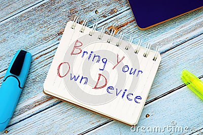 Career concept about Bring Your Own Device BYOD Policy with phrase on the piece of paper Stock Photo