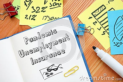 Career concept meaning Pandemic Unemployment Insurance with inscription on the sheet Stock Photo