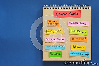 Career goals concept. Checklist of goals in note pad in blue background with copy space. Stock Photo