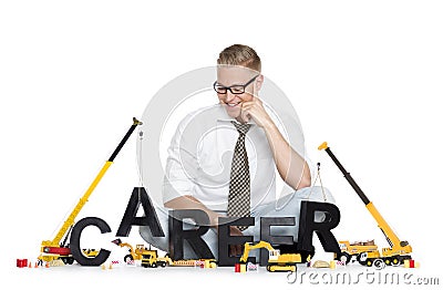 Career start up: Businessman building career-word. Stock Photo