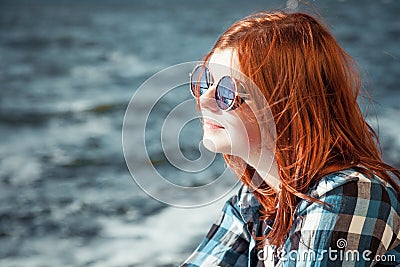 Carefree beautiful red hair young woman over seascape Stock Photo