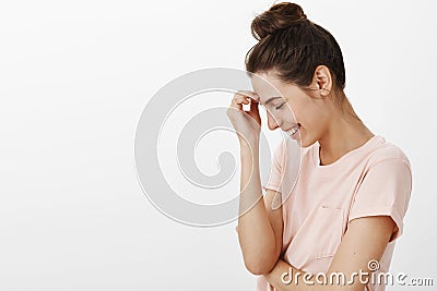 Carefree bight attractive female friend laughing out loud over funny joke standing in profile leaning on hand looking Stock Photo