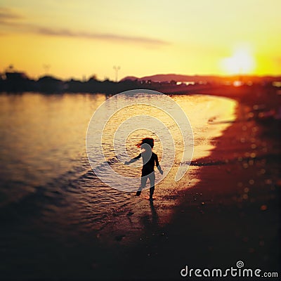 Carefree child running on beach Stock Photo