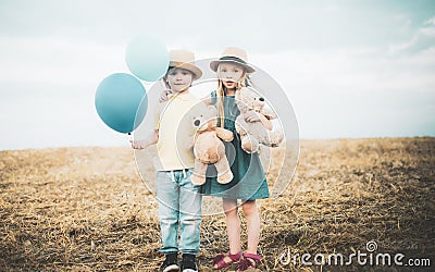 Carefree childhood. Happy kid on summer field. Happy children having fun together, love and friendship between siblings Stock Photo