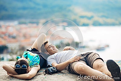 Carefree couple relaxing,looking at the cityscape view.Making a company.Stress free,freedom feeling.Happiness and mindfulness Stock Photo