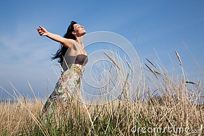 Carefree field woman Stock Photo