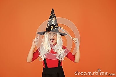 Carefree fun. small girl halloween party. mystery witch do magic. small child witch hat. trick or treat. supernatural Stock Photo