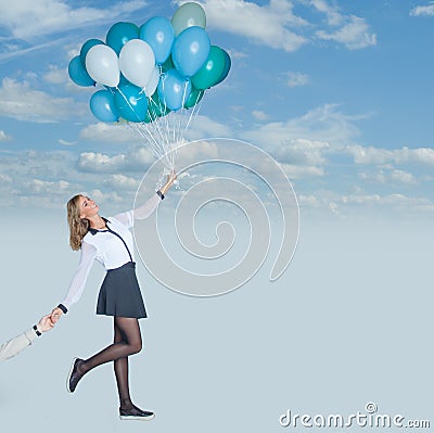 Carefree girl against the sky with blue balloons Stock Photo