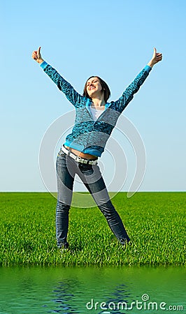 Carefree girl showing thumbs up Stock Photo