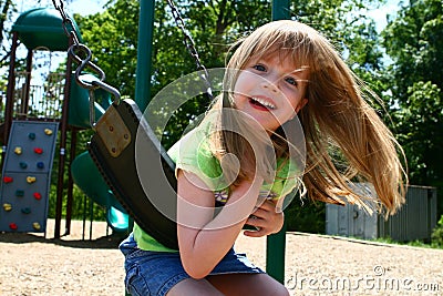 Carefree on a swing Stock Photo