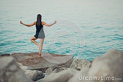 Carefree woman meditating in nature.Finding inner peace.Yoga practice.Spiritual healing lifestyle.Enjoying peace,anti-stress Stock Photo