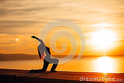 Carefree woman meditating in nature.Finding inner peace.Yoga practice.Spiritual healing lifestyle.Enjoying peace,anti-stress Stock Photo