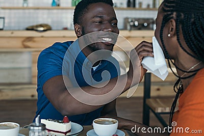 careful african american man cleaning girlfriend Stock Photo