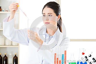 Careful, meticulous work of asian female scientist Stock Photo