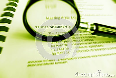 Carefully Studying tender documents Stock Photo