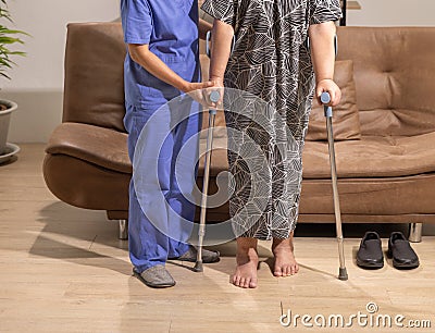 Caregiver takecare senior woman that leg is edema (swelling) . Stock Photo