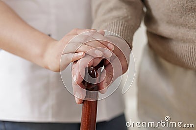 Carer holding old man hand Stock Photo