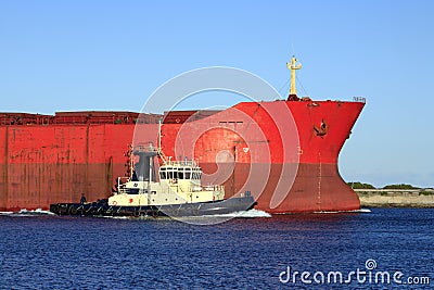 Cargo Boat with Tug Stock Photo