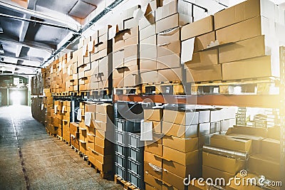 Cargo cardboard boxes for shipping and delivery in logistic storage warehouse hangar, interior of storehouse inside Stock Photo