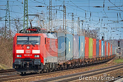 Cargo class locomotive with colorful wagons passing through Saarmund, Germany Editorial Stock Photo