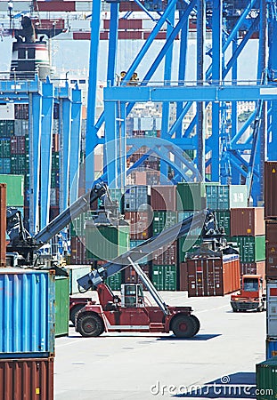 Cargo container boxes in dock terminal Stock Photo