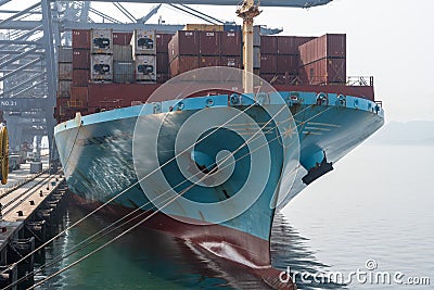 Cargo container ship `Maersk Singapore`, owned by Maersk, berthed in port of Yantian. Editorial Stock Photo