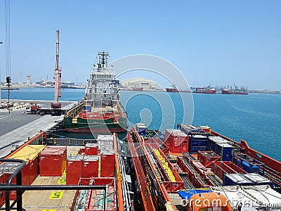 Cargo operations ongoing onboard supply vessel working for offshore platforms. Logistics background in Oil and Gas industry. Editorial Stock Photo