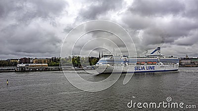 Cargo-passenger cruise ferry ship Silja Serenade by Tallink leaving South harbor of Helsinki, Finland at rainy overcast day Editorial Stock Photo