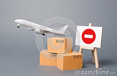 Cargo plane with boxes and an easel with a restriction sign. Restrictions on export of scarce and medical goods for the period of Stock Photo