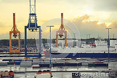Cargo port in Helsinki. Harbor cranes in sea cargo port with ship. Helsinki, Finland Stock Photo