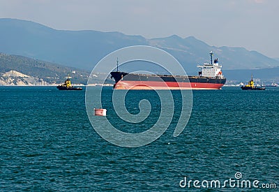 Cargo ship anchored in the roadstead Tsemes bay at the entrance of the port of Novorossiysk Stock Photo