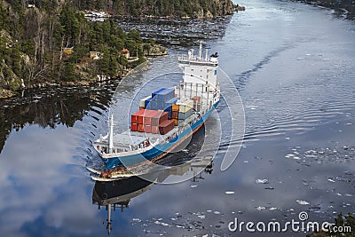Cargo ship leaving the ringdalsfjord Stock Photo
