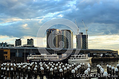 Cargo ships awaiting departure at docklands Editorial Stock Photo