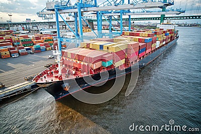 Cargo Ships Loaded with Cargo Sitting in Port Editorial Stock Photo