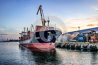 A cargo tanker moored at an industrial dock in Kherson Port Editorial Stock Photo