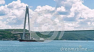 Cargo tanker ship sailing under Yavuz Sultan Selim bridge, Istanbul Editorial Stock Photo