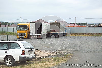 Cargo transportation lorries vans in motor transport depot on cl Editorial Stock Photo