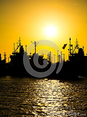 Cargo vessels at the sunset Stock Photo