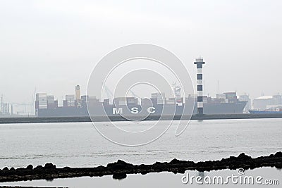 Cargoship in the harbour of the 2nd Maasvlakte near the Northsea Editorial Stock Photo