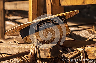 Traditional hat of the Monte toboggan basket drivers at the top of the ride near Funchal Editorial Stock Photo