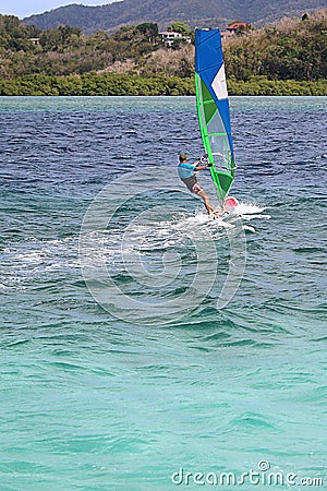 Caribbean feeling - Windsurfing in the beautiful warm turquoise water of the West Indies Editorial Stock Photo
