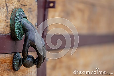 Island Artistry: Handcrafted Door Knocker Graces Grand Garage Door, Infusing Unique Elegance in Caribbean Living Stock Photo